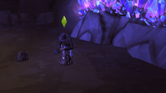 A sim chipping away at a rock in the Forgotten Grotto of "The Sims 4." You need Handiness to get in here.
