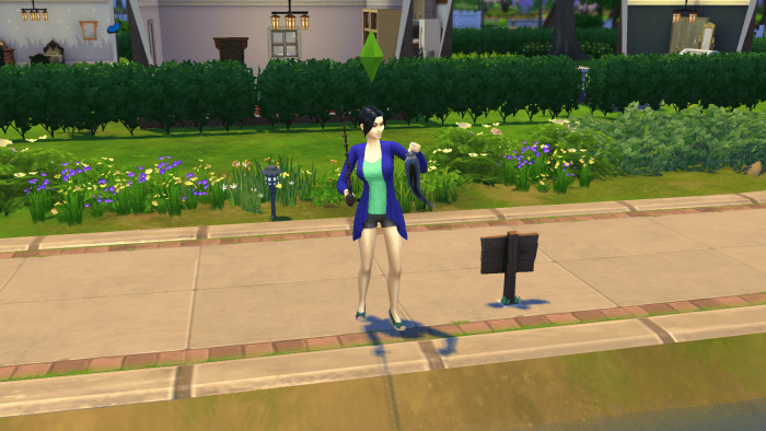 Here's a sim with a caught fish in "The Sims 4." Fish can be caught at fishing locations found across the world.