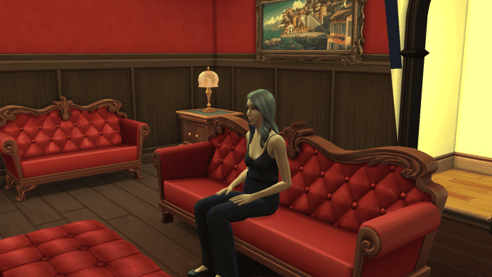 An elder sim in "The Sims 4," watching TV. Old age is one way your Sim can die, and it's often the most likely.