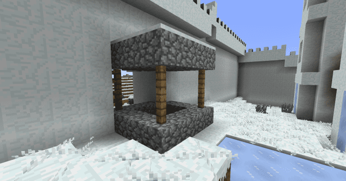 Village generation bugs, such as this well sitting in the town's only gate, are probably the mod's biggest issue.