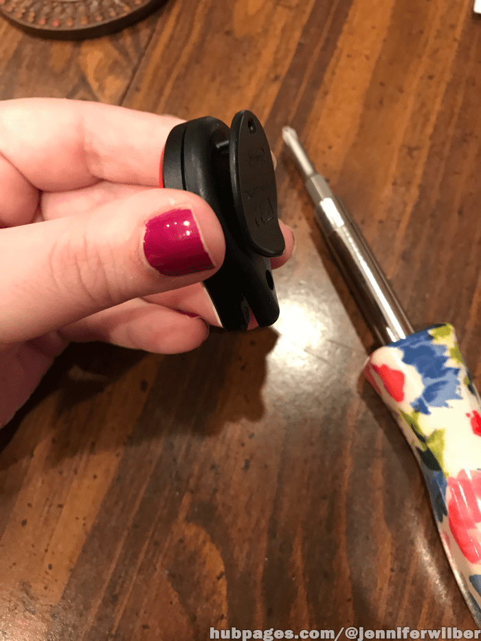 You are now ready to replace the back cover. Slide it onto the main part of the Pokemon Go Plus from the top to snap it back together before tightening the screw.