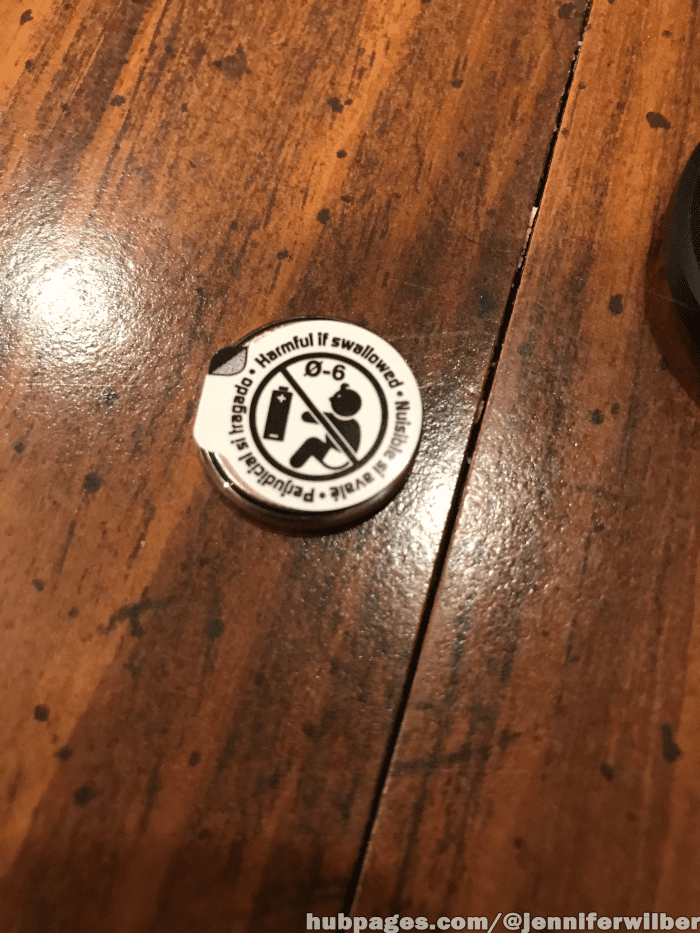Once you remove the new battery from the packaging, check for a sticker like this on the back. If it has one, remove it before placing the new battery into the device.