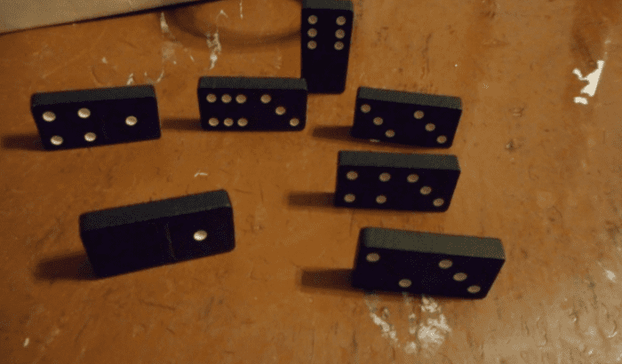 I don't have a Domino that I can play, so I place one Domino on end, signifying that I'm Up and my line is open.