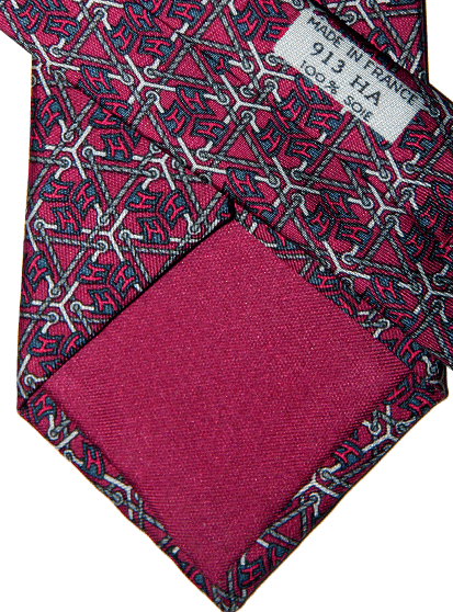 See how the interior lining matches the background color? That is a good indication of an authentic Hermès tie. Many of the counterfeit ones have black lining.