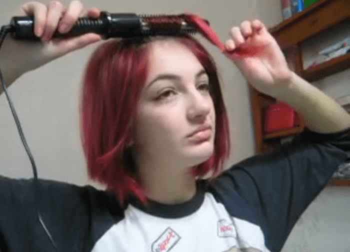 Roll the first section forward to the half-way point down the hair shaft.