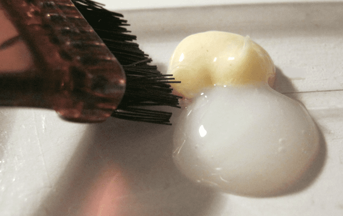 The white substance is developer, the darker one is the actual color, which in its present state never resembles the shade you want to dye your hair to - the one illustrated here is "light brown."