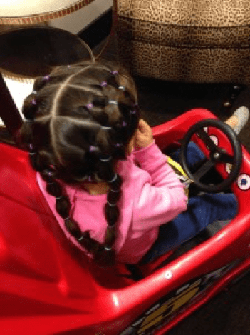 Cascading rubber band pigtails.