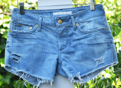 Frayed hems look good too. Just pull some of the cotton threads, then wash the cut off shorts.