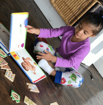Free explore time is critical in developing curiosity, independent thinking, and a love of learning. Today, Zoe chose reading a number book to "help her" with her number puzzles.