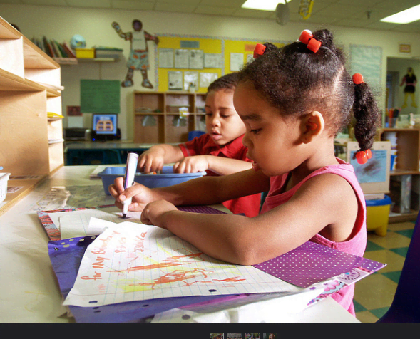 A home writing center promotes writing with a purpose, making posters, signs, cards, letters, and lists.