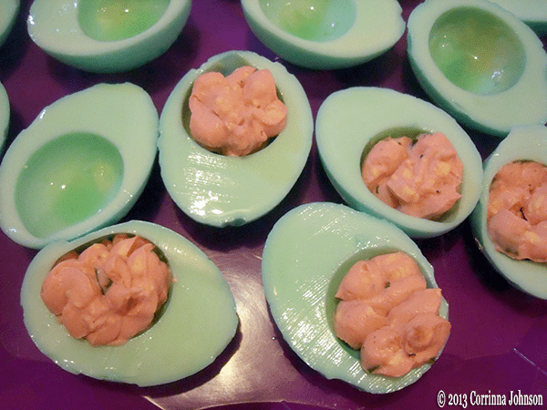 Step 8: Pipe the pink egg yolk mixture into the egg white halves