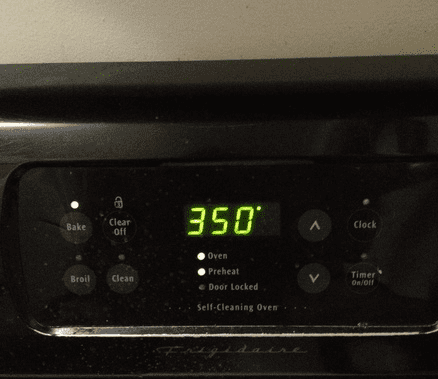 Don't put your cake in before the ding, or beep, or pop, or whatever your oven does to tell you it's hot enough.