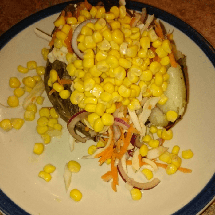 Jacket potato with homemade coleslaw and sweetcorn. Yummy vegan and gluten free dinner.