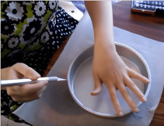 Use an X-Acto blade to cut around the bottom of the pan directly to get a perfect fit every single time.