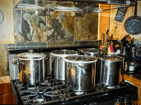 This is what happens when curds are left to culture longer than six hours ... so don't leave them overnight! I've never had curds actually overflow a pot, but they certainly grow!
