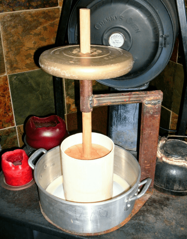 I am using a 10-pound weight. If your curds are quite juicy, you may wish to begin with a 5-pound weight for the first few minutes, and give them time to settle.