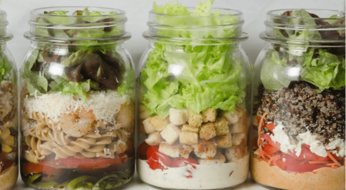 Different salads in mason jars