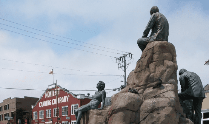 Author John Steinbeck, his bronze hair just lightly streaked with Pigeon (probably not Guillemot) poop, sits in profile, contemplating the birdwatching haven of Monterey's Cannery Row.