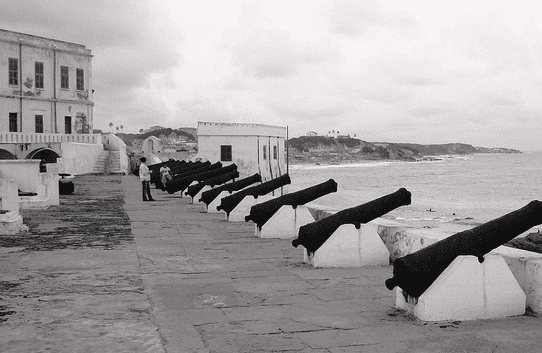 Elmina Castle, in present-day Ghana (formerly the Gold Coast) was the first slave trading post built on the Gulf of Guinea. This is where the slaves are traded and incarcerated before being exported to America, the Caribbean Islands, and Europe.