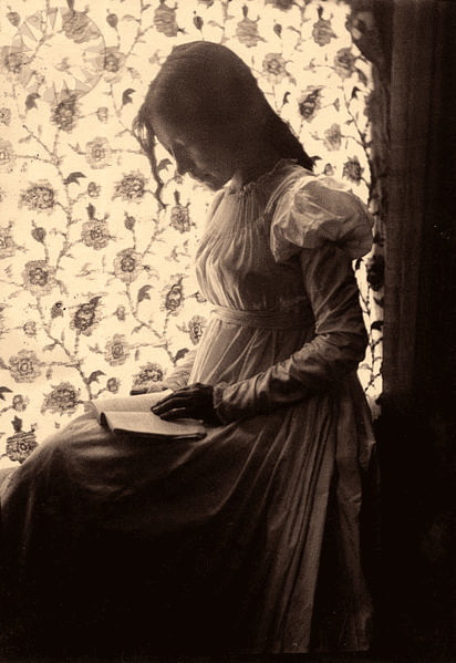 "Zitkala-Sa" reading by windowlight; "Zitkala-Sa" in pencil on verso ..Credit: Gertrude Kasebier (Smithsonian Institution)