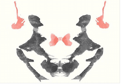 Rorschach test: I see an alien with big black eyes, its arms held aloft and antlers protruding from its head... yes, seriously.
