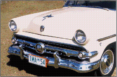 Both the 1954 Ford and 1952 Ford have slots in the grille side bars, but the 54 has small teeth in them. The 54 has more chrome above the grille bar and a more elaborate shape. The hubcap centres were red in the US and black in Australia.