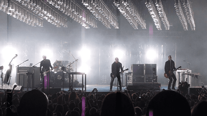 Nine Inch Nails on stage in 2009. It was the industrial band who first recorded the song in 1995 and later publicly performed it. The song, written by Trent Reznor, references self-harm and heroin addiction.
