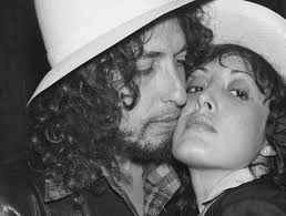 I have never seen a picture of Dylan this much in love. I know George Harrison took many of the most personal Dylan pictures.