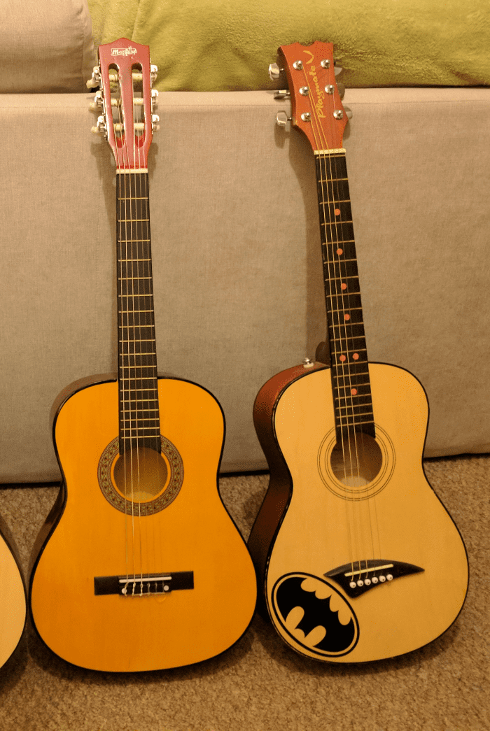 The size difference between classical and steel string guitars is most evident when comparing a half size steel string guitar (the one on the right) with a three quarter size classical guitar. They pretty much the same size.