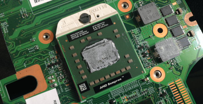 An AMD microprocessor, inserted onto a laptop motherboard socket