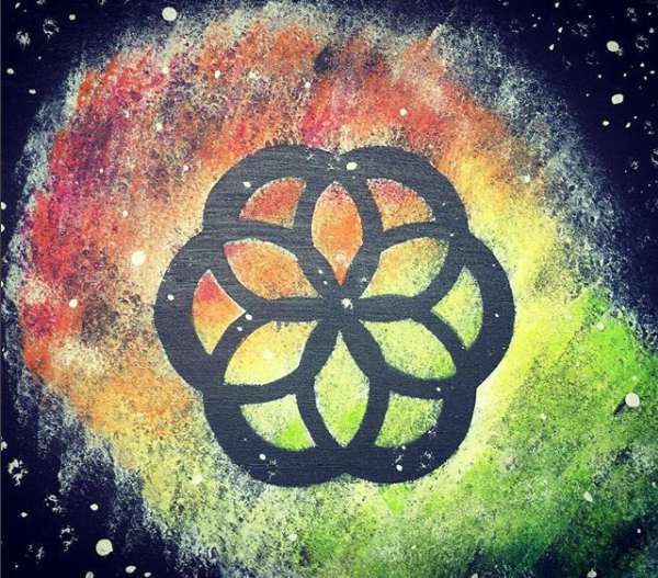 Transferring the seed of life design to my galaxy painting: The stencil was made using these techniques and then by cutting it out.