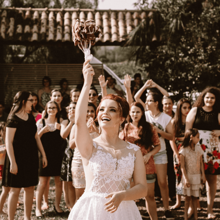 The throwing of the bride's bouquet is a longstanding wedding tradition that is still practiced by many.