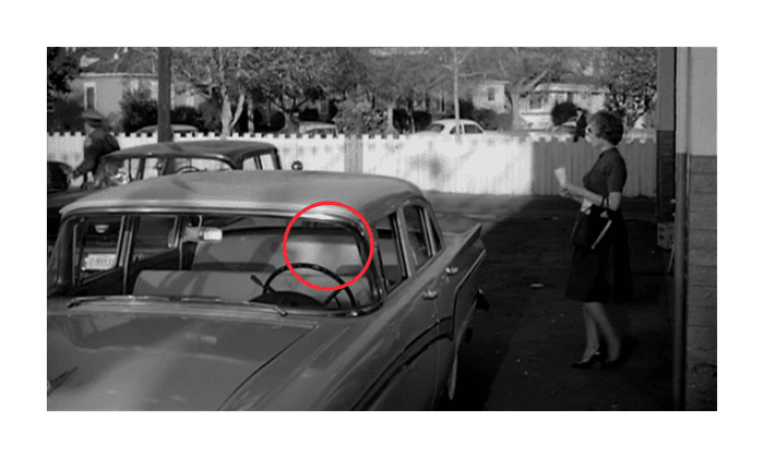 In the next shot the windshield is cleared without having bothered to show anyone wiping it down.