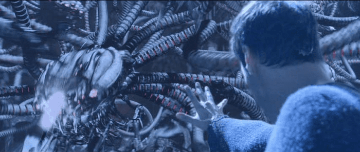 In The Matrix Reloaded, Neo is seemingly outside of the Matrix and is still able to exhibit some of the same powers he had within the Matrix.