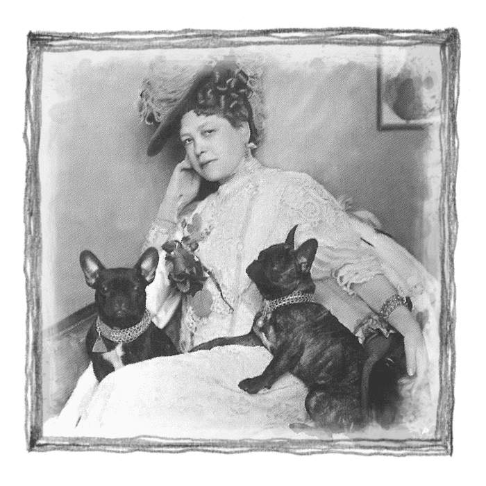 A photo of Esther Flint with her two French Bulldogs. Esther lived in our house but died in the early 1900s.
