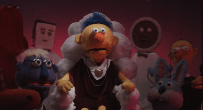 The return of all familiar faces in their ritualistic robes to bring in the yellow guy to their group