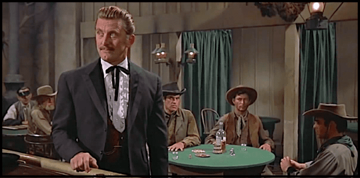 In this scene from 1957's western classic "Gunfight at the O.K. Corral" Kirk Douglas is about to kill bad guy Lee Van Cleef, seated at the table behind him..
