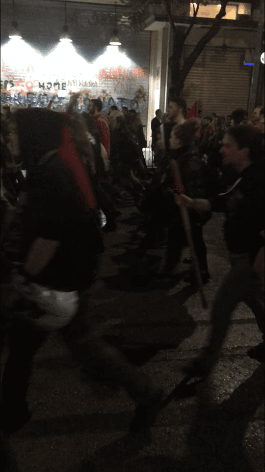 Individuals carry bike helmets for, what I hope was, self defense. This march has a reputation for ending with degrees of violence.