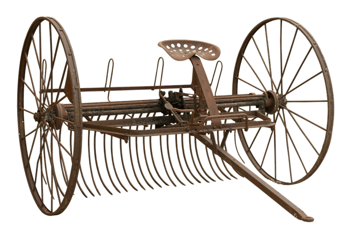 This is a hay rake. It was used after the hay cutter (top photo) had cut down a field of hay and the farmer raked the hay in straight rows for it to be baled.