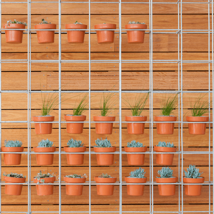 A metal potted plant holder might take a little more elbow grease to put together, but if done well, it can be a long-lasting solution to the problem of where to place your many potted plants.