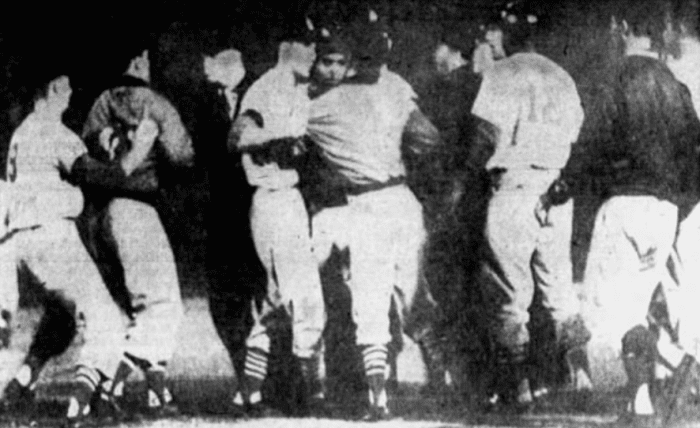 Players and coaches for the Dodgers and Cardinals argue on the field after Don Drysdale hit Joe Cunningham with a pitch during a game. The pitch was seen as intentional by St. Louis, though Drysdale denied any wrongdoing.