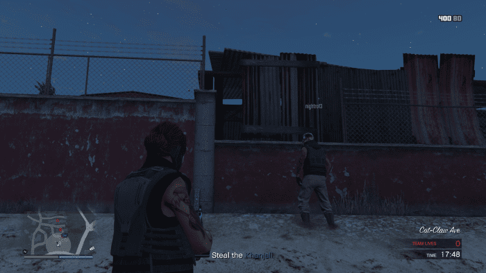 The "hole" in the enemy's defense along the wall. A Sticky Bomb will blast that piece of sheet metal away.