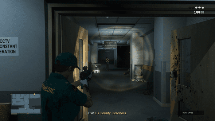When the Paramedic gets back down to the ground floor the lobby will be filled with Agents. Take cover at THIS doorway.