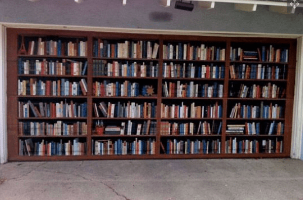 This is the garage door of former writer for the LA Times, Lee Dembart. Dembart loves books so much he had this trompe-l'oeil painted by artist Don Gray in 2005.