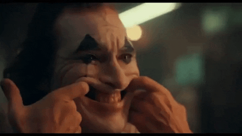 The gagged lapel pin that squirts out fake blood, the clown boots(care to step into his shoes?!) and the forced smile!..