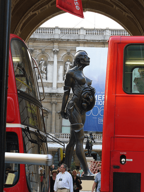 This is the 'Virgin Mother' statue in the Royal Academy, London (2005). A similar 66ft bronze statue by Damien Hirst, named 'Verity', has been installed at the harbour of Ilfracombe in Southern England (2012).