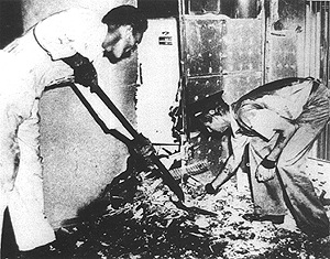 Investigating the scene of the aledged Spontaneous Human Combustion - Note the barely damaged partition.