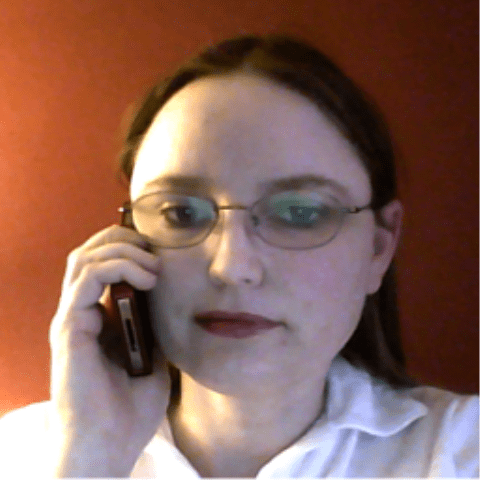 Woman talking on a cell phone/mobile phone.