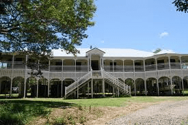 A large Queen-slander, note the pretty design, all the open space on the verandas and also all the open space under the house, which could be used in very hot summer days to catch the breeze and stay in the shade.