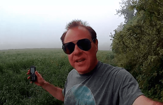 Gary using his Tracfone in a field to capture EVPs from spirits or other interdimensional beings